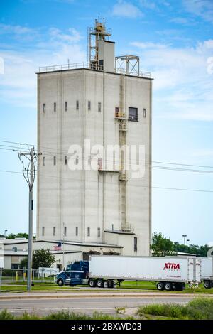 A semi truck with container enters the Cargill Animal nutrition operations plant, a pet food and farm animal feed factory in Big Lake, MN, USA Stock Photo