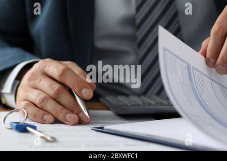 Man in presentable grey suit Stock Photo
