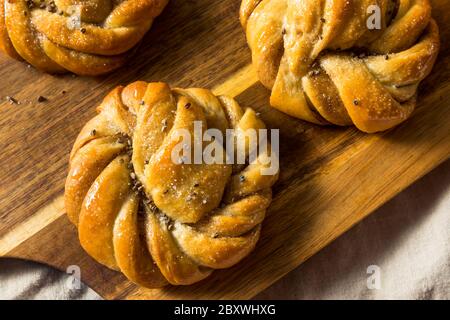 Sweet Homemade Swedish Cardamom Buns with Sugar for Breakfast Stock Photo