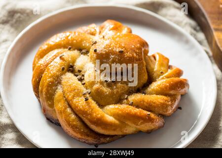 Sweet Homemade Swedish Cardamom Buns with Sugar for Breakfast Stock Photo