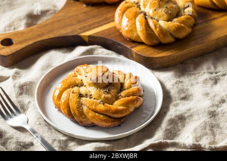 Sweet Homemade Swedish Cardamom Buns with Sugar for Breakfast Stock Photo