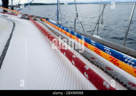 white yacht deck with colorful ropes Stock Photo