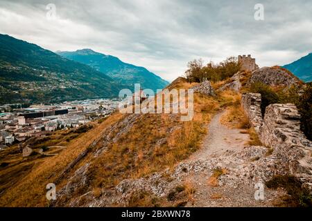 Sion, Switzerland: Ruines of Tourbillon Castle located on a hill with Valere basilica in a background Stock Photo