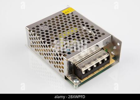 Transformer for LED lighting. Power supply, transformer for making advertising, LED screens and scoreboards on a white background. Stock Photo