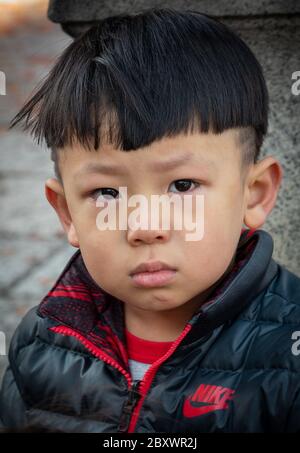 A young Japanese boy at the Kiyomizu Dera shrine. Not too happy, and just cried after his mother refusal to buy him candies.... Stock Photo