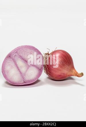 Red and gold onions isolated on white background Stock Photo