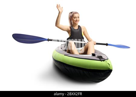 Woman kayaking and waving at the camera isolated on white background Stock Photo