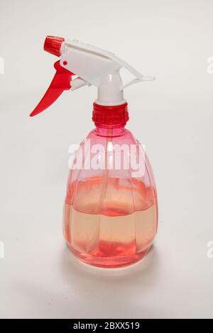 Pink transparent foggy spray bottle isolated on white background Stock Photo