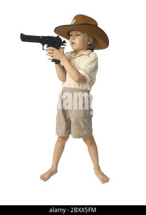 Boy with a toy gun in a hat over white background Stock Photo