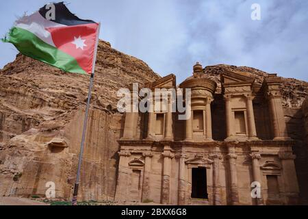 Ad Deir, The Monastery, in Petra, Jordan with Jordanian flag flying Stock Photo