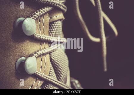 Lacing of a brown leather adventure boot, Close up Stock Photo