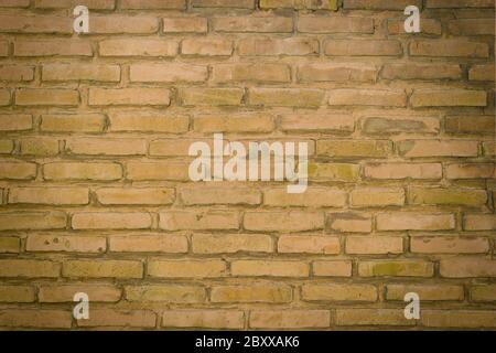 A section of a send brown brick wall background Stock Photo