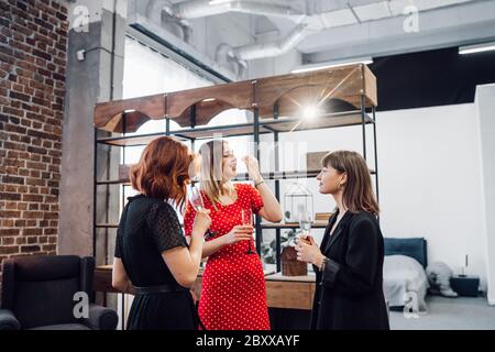 Happy colleagues in office celebrate special event. Stock Photo