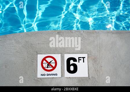 swimming pool depth marker Stock Photo - Alamy