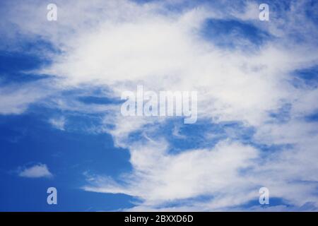 Blue bright sky with white clouds background Stock Photo