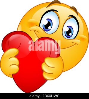 Happy emoji emoticon hugging a red heart Stock Vector