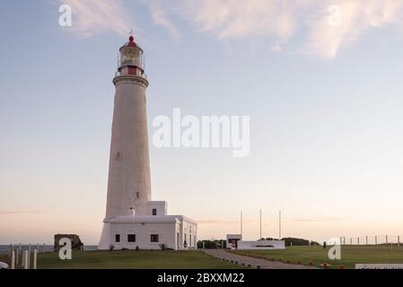 Lighthouse of Cabo de Santa Maria, an Uruguayan emblematic building declared National Historic Monument, located in La Paloma, Rocha, Uruguay. Sunset Stock Photo