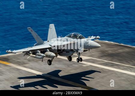 A U.S. Navy EA-18G Growler fighter aircraft assigned to the Rooks of Electronic Attack Squadron 137 lands on the flight deck of the Nimitz-class aircraft carrier USS Harry S. Truman June 2, 2020 operating in the Atlantic Ocean. Stock Photo