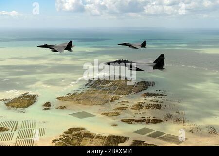 U.S. Air Force F-15 Eagle fighter aircraft, assigned to the 48th Fighter Wing conduct a flypast over the beaches and battle sites to mark the 76th anniversary of D-Day June 6, 2020 in Normandy, France. Stock Photo