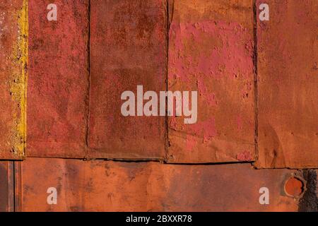 rusted tin sheets patchwork wall texture and flat background Stock Photo