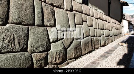 Hatun Rumiyoc street with Incan twelve angle stone in Cusco, Peru. Stock Photo