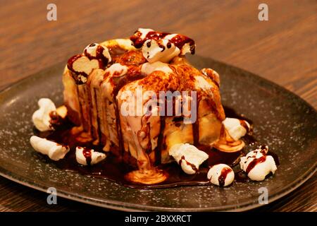 melted chocolate cake with vanilla and raspberry filling Stock Photo