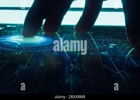 hand touching a screen table with technological interface. interface visual table screen. Concept of internet of things Stock Photo