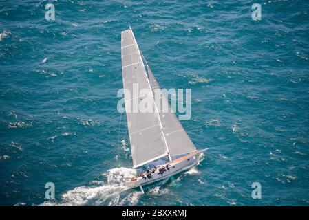 The yacht Caro makes its way out off Sydney Harbour in the 2014 Sydney to Hobart Yacht Race Stock Photo