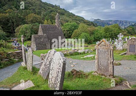 Glendalough in Ireland's Wicklow Mountains National Park preserves an early Medieval monastic settlement founded in the sixth century by St. Kevin. Stock Photo