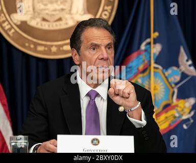 New York, United States. 08th June, 2020. Governor Andrew Cuomo wearing bracelet 'NY Tough' speaks during daily media briefing on first day of Phase One reopening of NYC at 633 3rd Avenue office in New York on June 8, 2020. On June 8, 2020 New York City enters Phase One of a four-part reopening plan after spending months under lockdown because of COVID-19 pandemic. (Photo by Lev Radin/Sipa USA) Credit: Sipa USA/Alamy Live News Stock Photo
