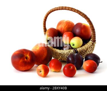 Basket of fruits isolated on white background. Stock Photo