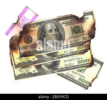 100 dollar bills burned financial loss recession depression risk Stock Photo