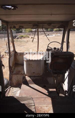 An old abandoned vintage delivery truck van in a field Stock Photo