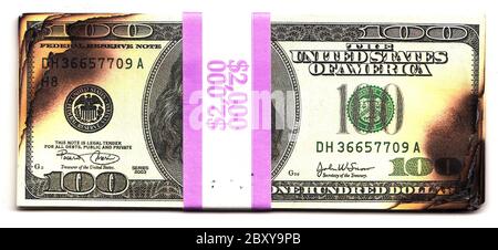 100 dollar bills burned financial loss recession depression risk Stock Photo