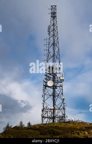 (BTS) Base transceiver station  with antenna isolated on blue sky background. Telecommunications radio tower cells Stock Photo