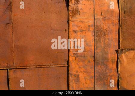 rusted tin sheets patchwork wall texture and flat background Stock Photo