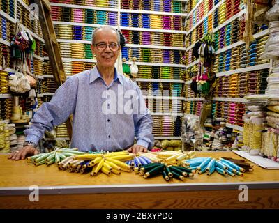 FEZ, MOROCCO - CIRCA MAY 2018: Portrait of Moroccan merchant at the Medina in Fez Fes el Bali. is the oldest walled part of Fez, Morocco. Stock Photo