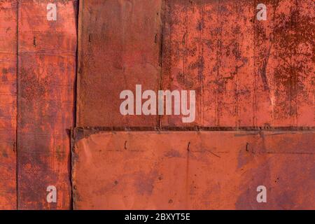 rusted tin sheets patchwork wall texture and flat background Stock Photo