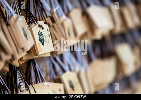 Tokyo Japan October 30th 2016 : Shallow depth of field view of wooden prayer boards at the Meiji Shrine in Tokyo Japan Stock Photo