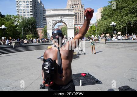 New York, New York, USA. 8th June, 2020. Justa'', 46, of Brooklyn demonstrates as any being any black man in America during a rally at Thompson Square Park in New York, New York. I travel a lot to Minneapolis and it could very well could have been me under that knee and I cried when it happened.'' Thousands of people protested across the United States and in cities around the world for a 12th day of outrage over police brutality intensified over the death ofÂ George Floyd. Credit: Brian Branch Price/ZUMA Wire/Alamy Live News Stock Photo