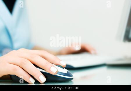 Female hands using computer Stock Photo