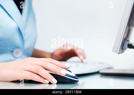 Female hands using computer Stock Photo