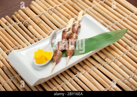 Grilled chicken hearts on skewers Stock Photo