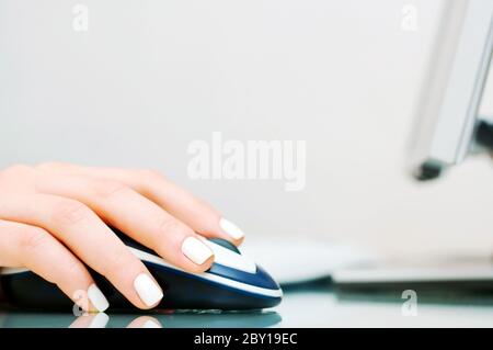 Female hands working on computer Stock Photo