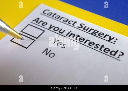 One person is answering question about cataract surgery. Stock Photo