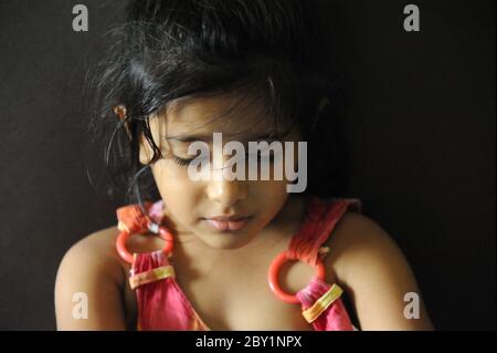 Mumbai, Maharashtra, India, Asia, May. 25, 2015 - Portrait of four years old cute little indian/asian girl smiling Stock Photo