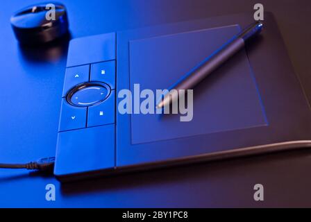 drawing tablet in blue light Stock Photo