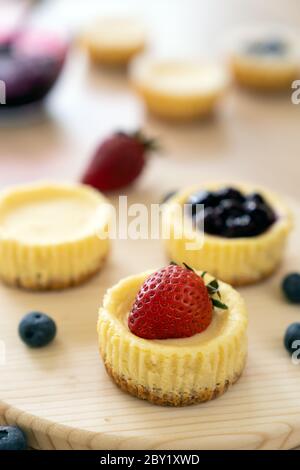 Mini cheesecake decorated with blueberry, blackberry and strawberry Stock Photo