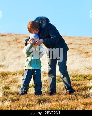 Family make photo on autumn  mountain plateau Stock Photo