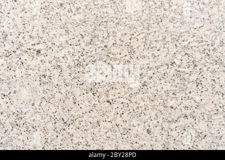 Textured light background. Mineral marble chips close up. Decorative plastering of walls, external decoration of the facade. Stock Photo